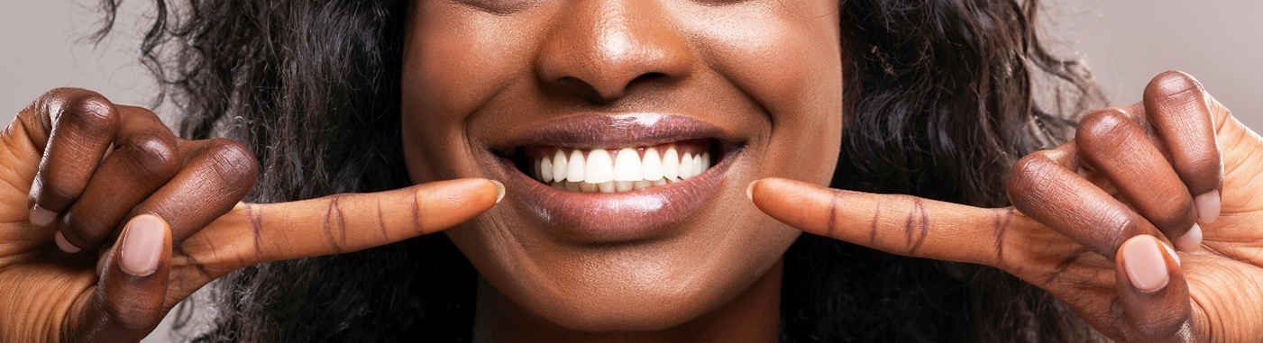 Woman showing off new smile with cosmetic bonding in Frankfort