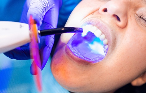 Person receiving cosmetic dental bonding